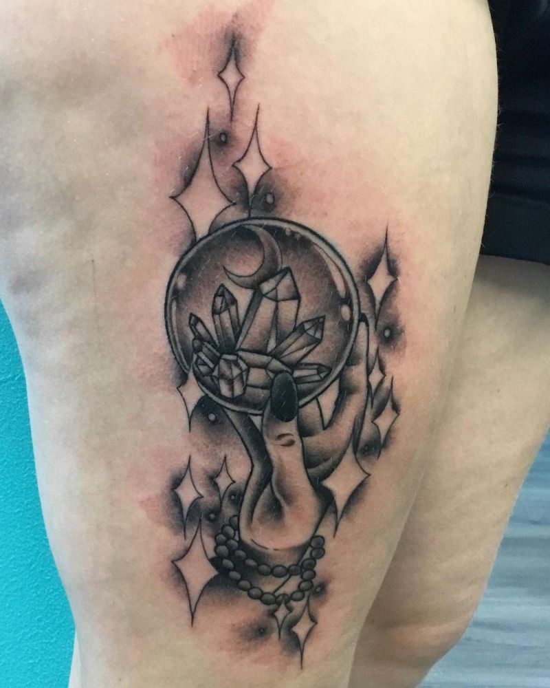 20 Unique Crystal Ball Tattoos to Inspire You
