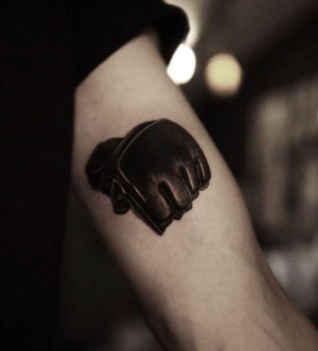 Black Leather Glove Fist Tattoo on Arm