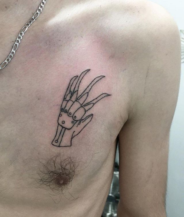 Unique Glove Tattoo on Chest