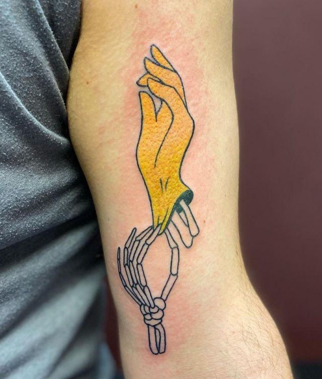 Unique Hand Skeleton Yellow Glove Tattoo on Arm