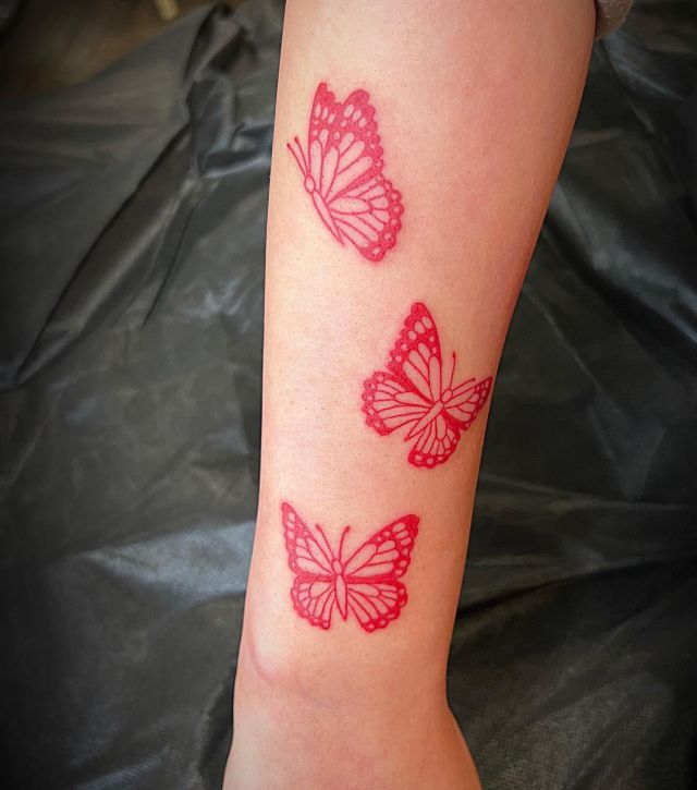 Three Red Monarch Butterflies Tattoo on Arm