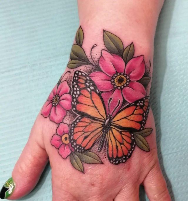 Monarch Butterfly Tattoo With Flower on Hand