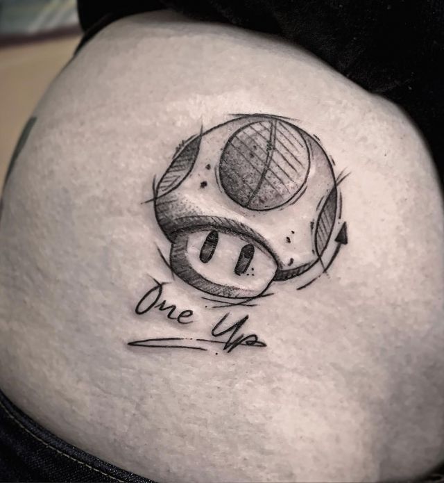 Black Mario Mushroom Tattoo on Belly