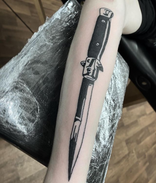 Unique Switchblade Tattoo on Leg