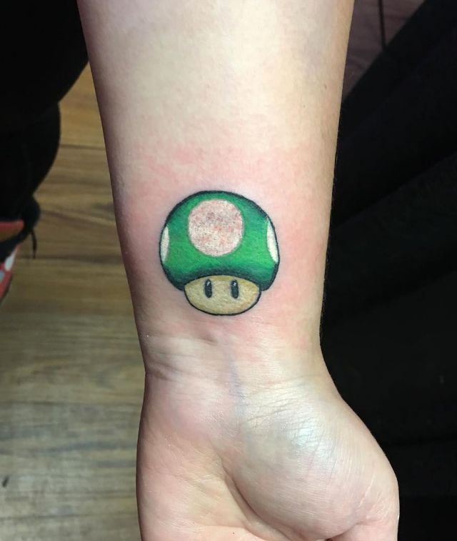 Cute Green Mario Mushroom Tattoo on Wrist
