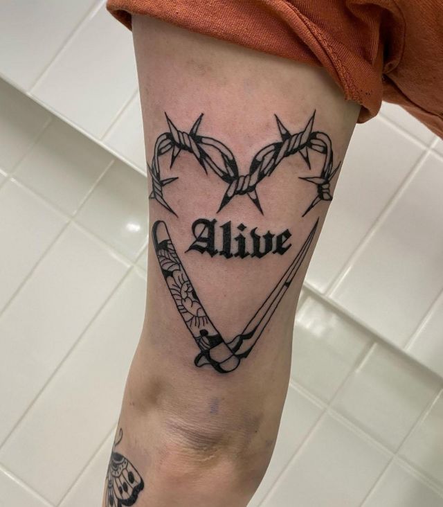 Barbed Wire Heart Alive Switchblade Tattoo on Leg