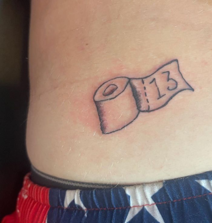 Small Toilet Paper Tattoo on Belly