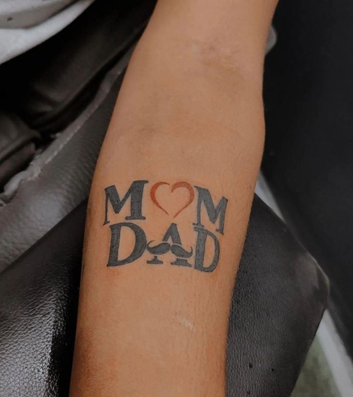Unique and Funny Mom Dad Tattoo on Upper Arm