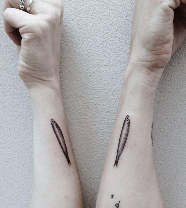 Tiny Paired Anchovy Tattoo on Arm