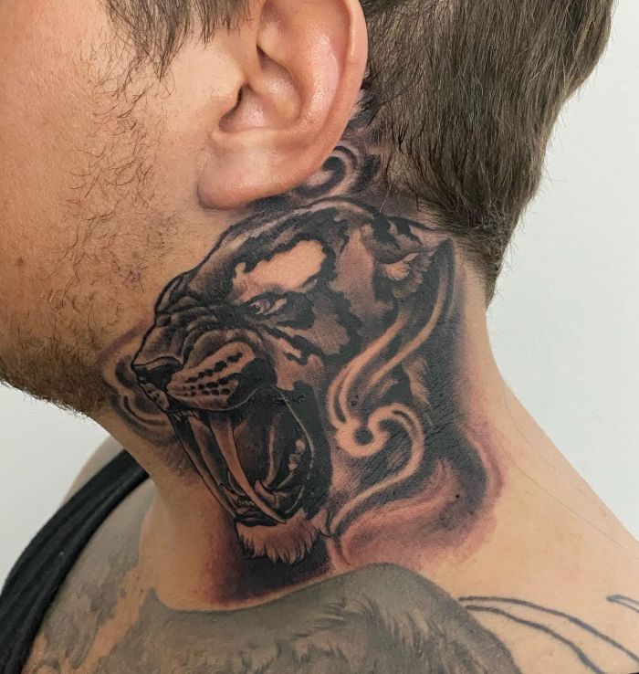 Colourful Saber Tooth Tiger Tattoo on Arm