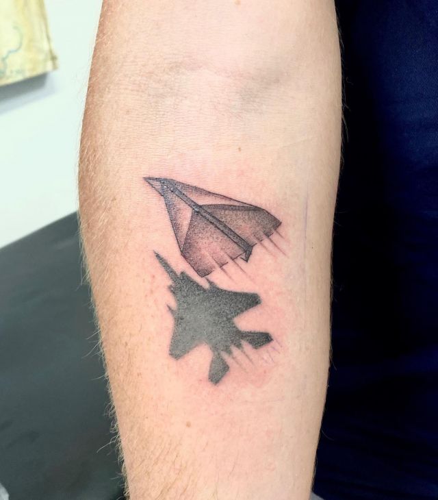 Pretty Paper Jet Tattoo on Forearm