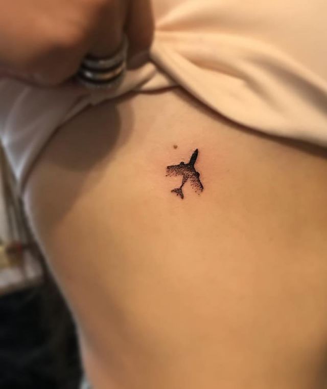 Small Jet Tattoo Underbreast