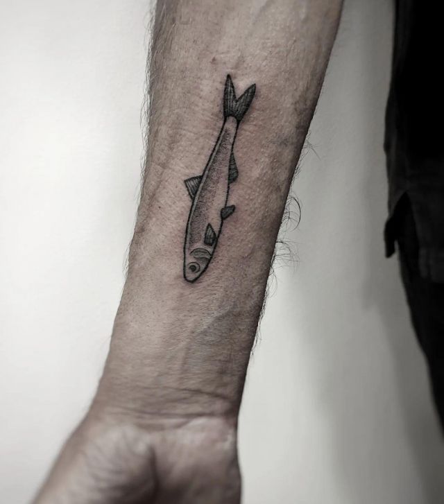 Small Anchovy Tattoo on Forearm