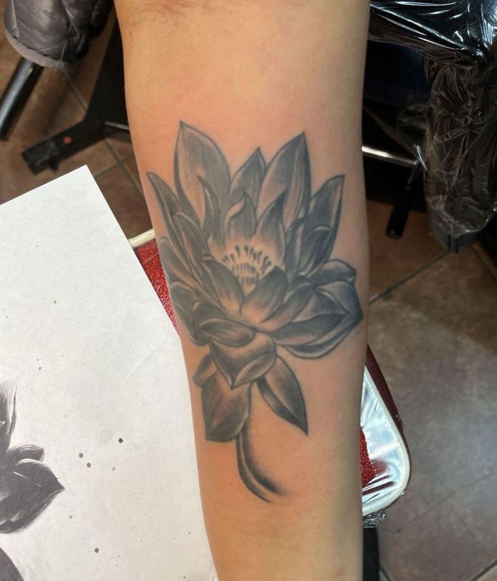 Pretty Black Lotus Tattoo on Forearm