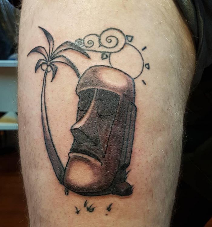 Unique Moai Tattoo with Palm Tree on Arm